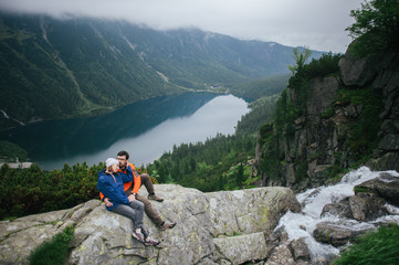 Traveler couple in love enjoying the mountains