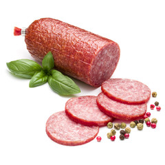 Salami smoked sausage, basil leaves and peppercorns isolated on white background cutout
