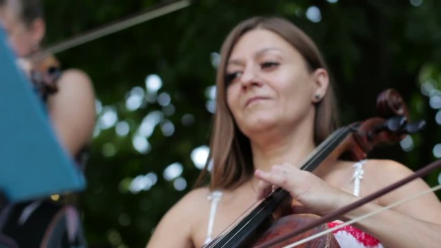 Woman playing dynamically on cello