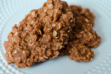 Delicious homemade no bake chocolate, peanut butter and oatmeal cookies.  Sweet confection dessert.