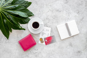 How much. Restaurant bill, bank card, wallet, coins near cup of coffee on light stone table top...