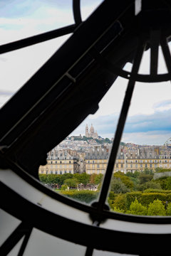 view of Montmartre through a clock window