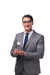 Businessman holding star award in business concept