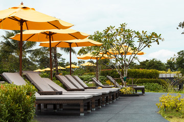 Outdoor beach chairs and yellow umbrellas
