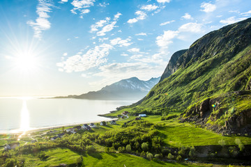 Green valley by water
