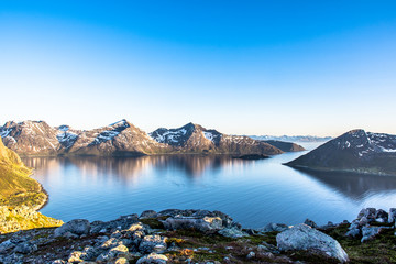 Fjord mountain midnight sun perfect reflection