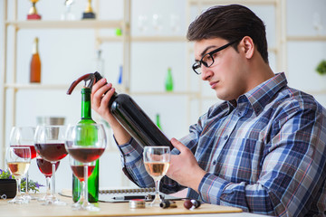 Professional sommelier tasting red wine 