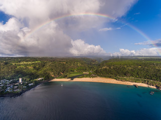 Aerial view of Waimea bay beach with a full Rainbow on the north shore of Oahu Hawaii 