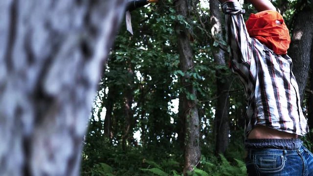 B- Horror Halloween Movie - Axe Murderer slasher man throws his axe at a teenager