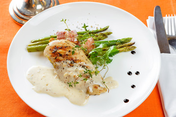 Chicken fillet with asparagus and sauce
