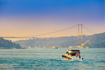 set of the ships passes across the canal Bosphorus, on a background the bridge through the passage,...