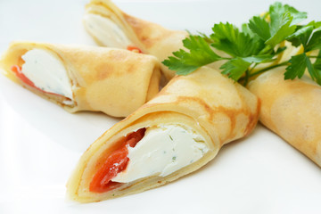 Pancakes with cheese and salmon