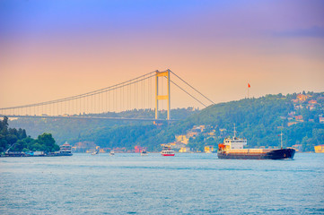 set of the ships passes across the canal Bosphorus, on a background the bridge through the passage,...