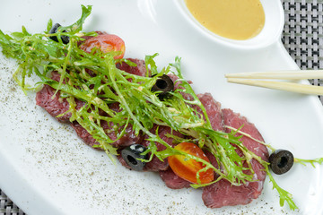 Beef with prepared dandelion