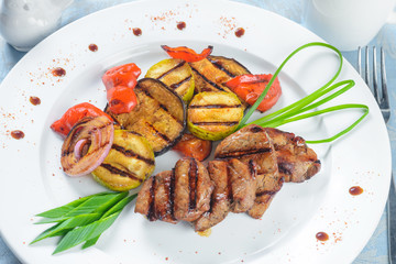 Fried meat with grilled vegetables