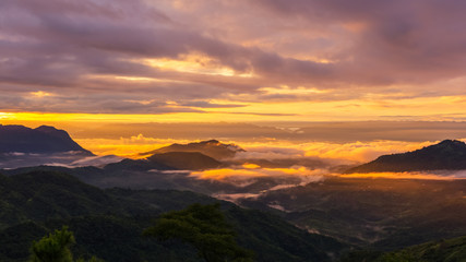 Fototapeta na wymiar The rising sun, sky cloud sunrise abstract with mountain, background and fog