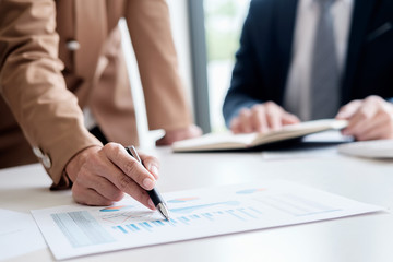 Attractive meeting at nonprofit boardroom group of employees at conference table workers collaborate in discussion