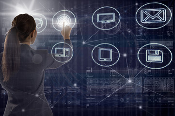 Back side of Asian young businesswoman standing and pointing the technology digital virtual screen background, business Technology and innovation concept