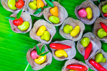 Fototapeta na wymiar Thai sweet dessert on green banana background. Thai traditional dessert.