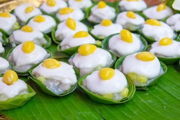 Thai sweet dessert on green banana background. Thai traditional dessert.