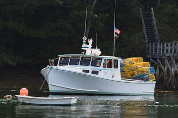 Lobster boat moored in early autumn in South Bristol, Maine, United States