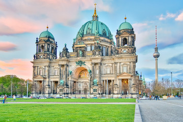 Dramatic sky with Berlin Cathedral and Television Tower in Berlin, Germany