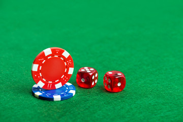 Casino green table with chips and dices