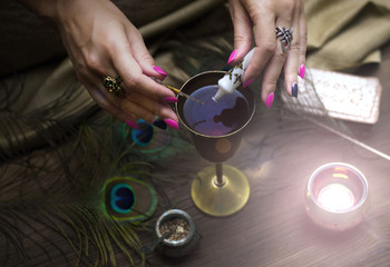 Tarot cards on fortune teller table. Divination. Witchcraft. Witch prepares a magic potion.