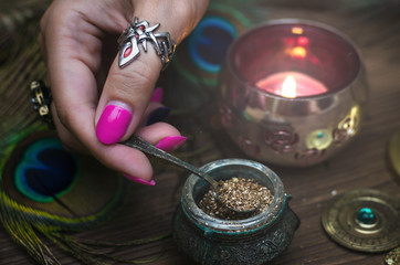  Witch prepares a magic potion. Fortune teller table. Divination. Witchcraft.