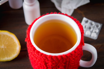 Drugs for colds - pills, spray. Folk remedies - lemon, tea, raspberry jam. Thermometer, handkerchiefs. Treatment of illness, influenza.