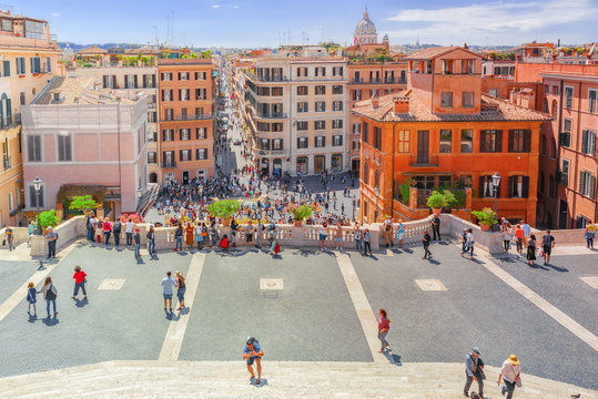  Beautiful landscape  historical view of the Rome, street, people, tourists on it. Spanish Sqare (Piazza di Spagna) and descent from the Spanish Stairs. Italy.