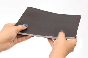 Hands Holding black book Sheet