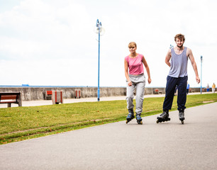 Active young people friends rollerskating.