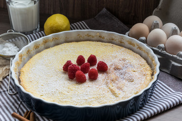 Homemade cheesecake with raspberries and lemon. Delicate dessert for coffee