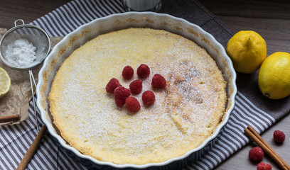 Homemade cheesecake with raspberries and lemon. Delicate dessert for coffee
