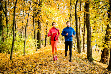 Friends jogging in autumn nature