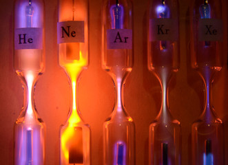 Tubes with inert gases excited with high voltage. From left to right: Helium, Neon, Argon, Krypton and Xenon. Each tube emits a different color and intensity.