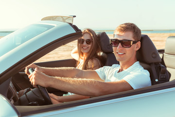 Young couple traveling by car