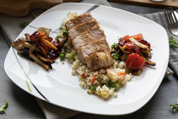 Pork medallions with grilled vegetables and vegetable couscous. Excellent food