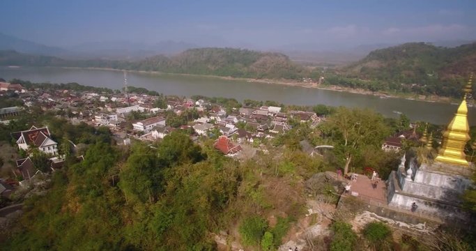 Aerial Slider Shot Of Golden Chedi On Mount Phousi, Luang Prabang, Laos

