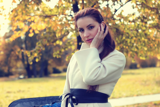 girl in a park walk autumn alone