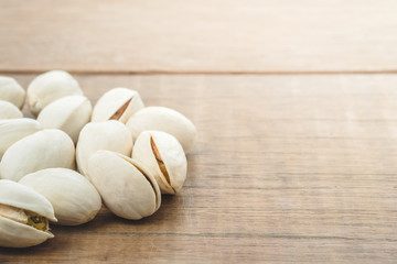 pistachio nuts on wooden table rustic surface
