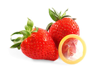 Strawberries with condom on white background. Sex concept