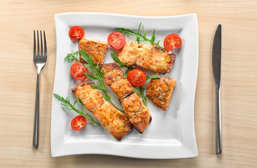 Delicious roasted salmon fillets with vegetable on plate