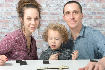 happy family playing dominos