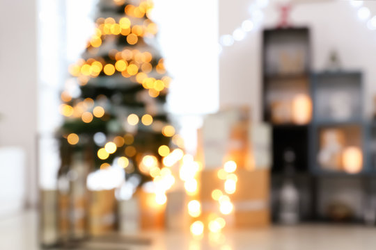 Blurred view of Christmas interior with beautiful fir tree