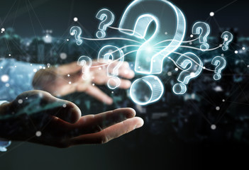 Businessman holding hand drawn question marks