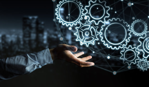 Businessman holding hand-drawn gears icons