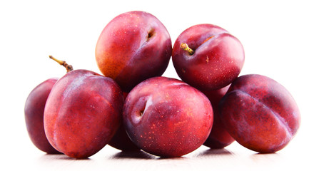 Composition with plums isolated on white background