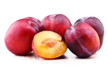 Composition with plums isolated on white background